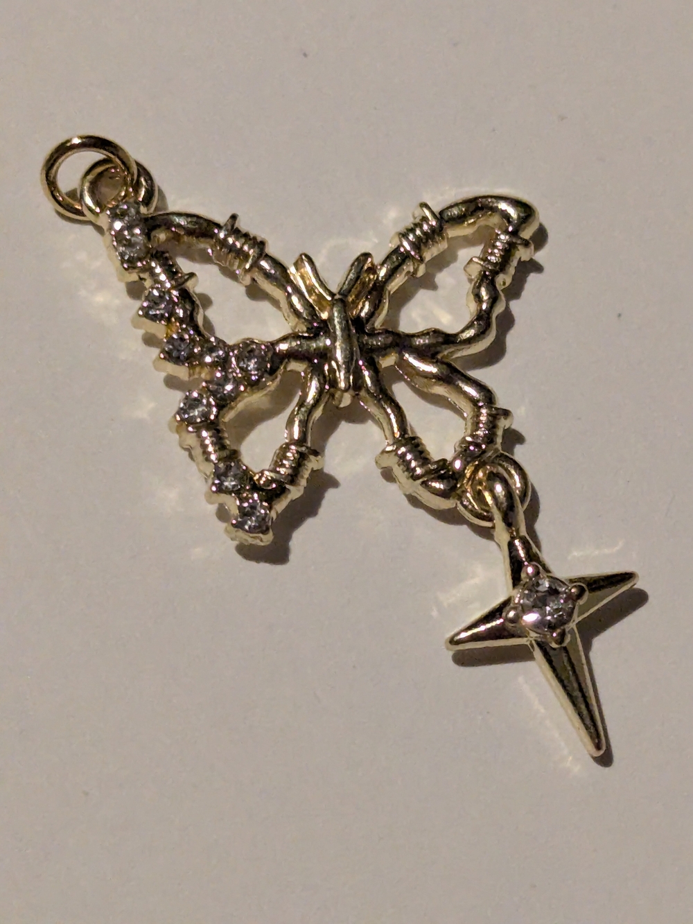 Gold Butterfly Charm Pendant with Star Accent